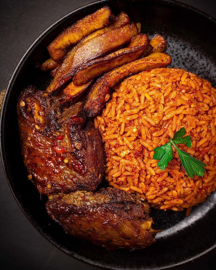 Basmati Smoky party jollof Rice served with protein of your choice, plantain and coleslaw