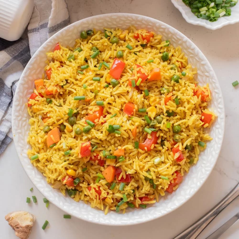 Basmati Fried Rice served with protein of your choice, plantain and coleslaw